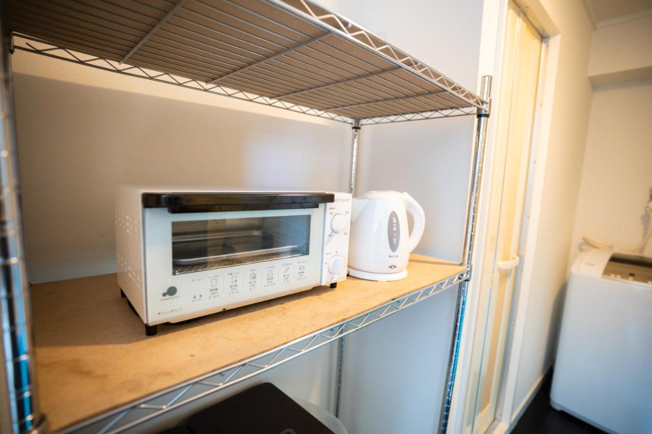 スマイルハイツ Apartamento Naha Exterior foto